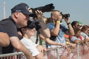 Audience members watch the U.S. Air Force Thunderbirds aerial performance during the 2017 JBA Air Show.
